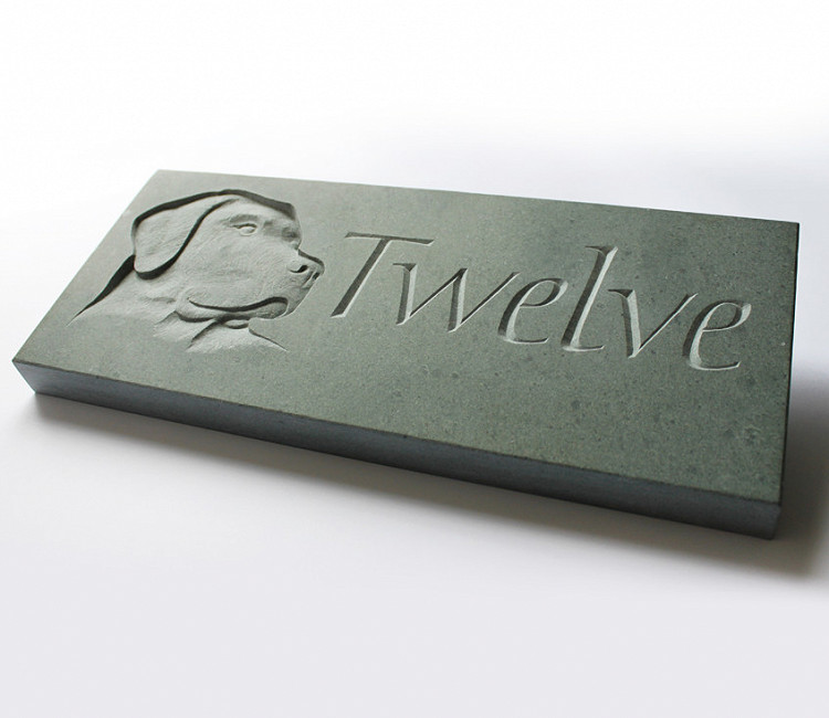 Carved green slate house sign