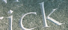 Incised letter close up green slate