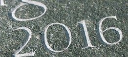 Incised numbers close up green slate