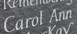 Riven slate painted incised letters