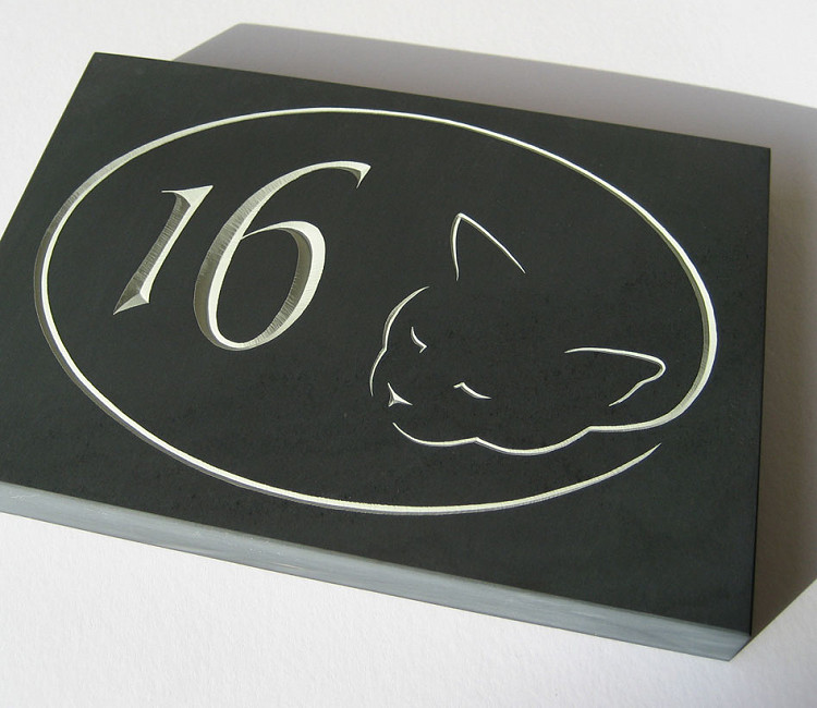 Carved slate house number