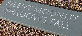 Incised roman capitals on green slate