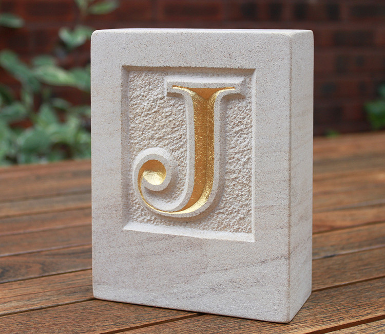 Gilded limestone bookend