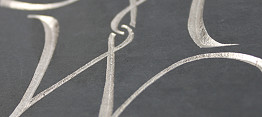 Incised gilded monogram in slate